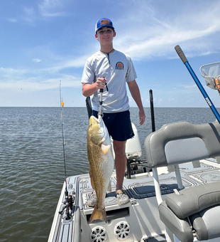 Huge redfish reeled in during a perfect day on the water!