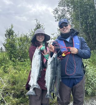 Reeling in fresh salmon on the legendary Kenai River — Alaska salmon fishing at its finest.