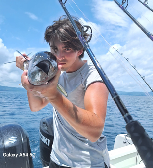 Focused angler showing off a fresh Tuna catch off Playa Flamingo!