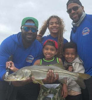 Family Reeling in redfish Tampa FL