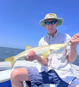 Reeling in another catch on the water.