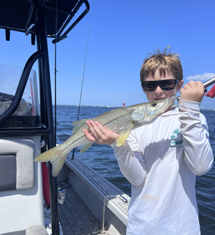 Snook on the line in Riverview's partly cloudy skies!