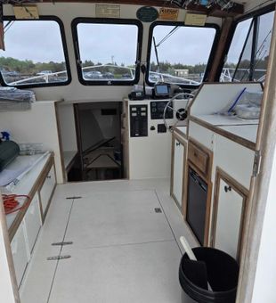 Ready for Cape Cod fishing adventures from the helm.