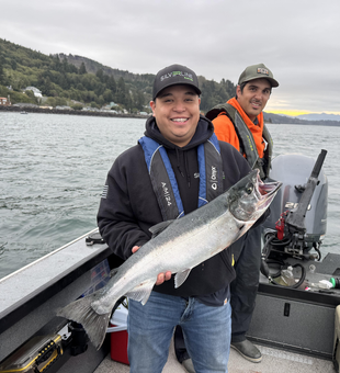 Nice Coho salmon using trolling techniques today. Cloudy conditions made for exciting fishing action.