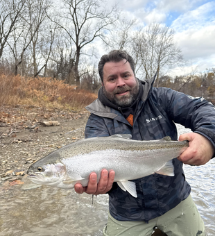 Nice rainbow trout on the fly! Exciting day on the water despite the cloudy conditions.