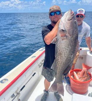 Creating unforgettable family memories offshore fishing in Panama City Beach with trophy fish and sunshine-filled days.