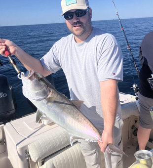 Reeling in a big one out on the open waters.