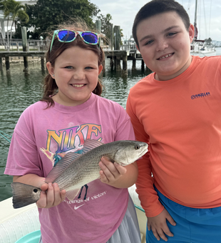 Young anglers land a beautiful Clearwater redfish!