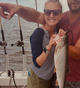 Smiling with success – Lake Trout catch on the boat!