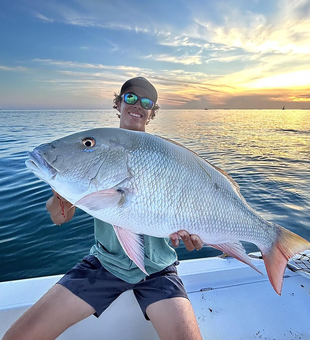 The boat docked at sunrise, ready for another day of fishing.