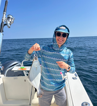 Nice catch using deep sea jigging techniques in partly cloudy conditions!