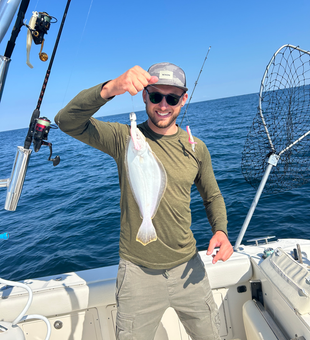 Nice summer flounder using deep sea jigging techniques in partly cloudy conditions!