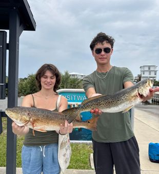 Exciting day on the water with a beautiful Redfish and Speckled Trout catch!