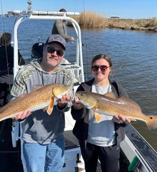 Proud smiles with the catch of the day!
