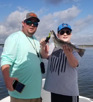 Pumped! Nice speckled trout in hand.