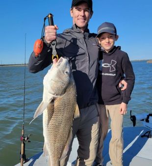Father and Son black drum fishing TX