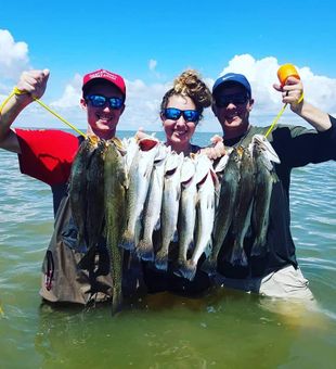 Group Fishing For Trout In Galveston, TX
