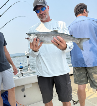 Huge 63-inch Chinook reeled in during a perfect day of light tackle trolling!