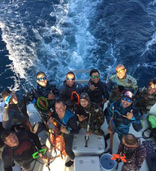 Spearfishing team prepped for deep dives offshore.