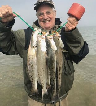 Proud stringer of quality Speckled Trout