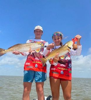 Proud young anglers with quality Redfish