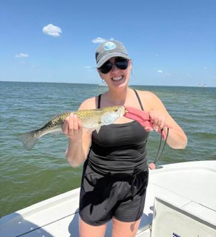 Hauling in the big one on a great day by the water!
