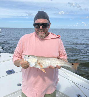 Nice redfish using deep sea and light tackle techniques in partly cloudy conditions!