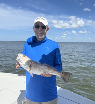 Nice redfish caught using deep sea and light tackle techniques in partly cloudy conditions!
