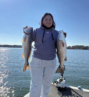 Double redfish using jigging and trolling techniques in partly cloudy conditions!