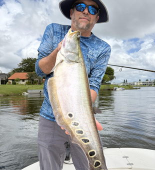 Great catch using light tackle trolling! Partly cloudy conditions made for perfect fishing.