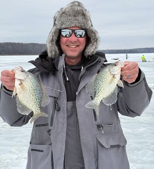 Ice fishing season in Mosinee, WI—bundled up and reeling in bites