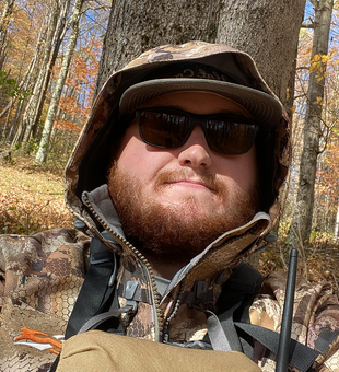 Rugged Hunting Guide in the Woods