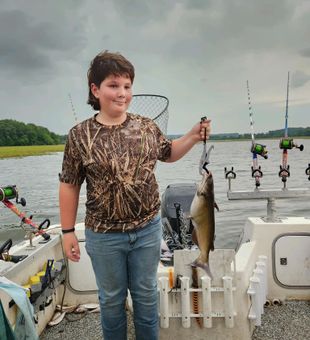 Great catch—young angler with a catfish!