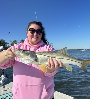 Nice snook using deep sea jigging in clear conditions at O'Neill's Marina!