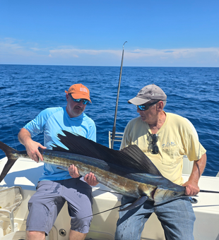 Nice Atlantic Sailfish caught using deep sea jigging and trolling techniques in partly cloudy conditions.