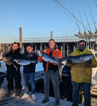 Pumped crew with impressive Striped Bass haul.