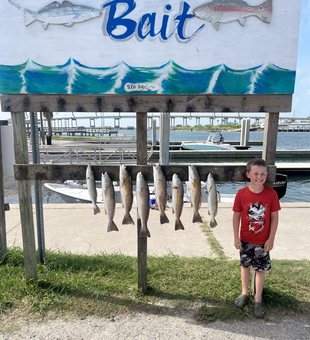 Proud young angler with a solid inshore lineup!