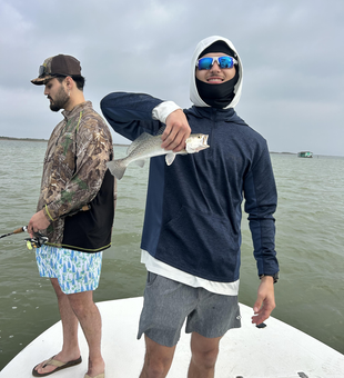 Enjoying the outdoors on the water with a catch.