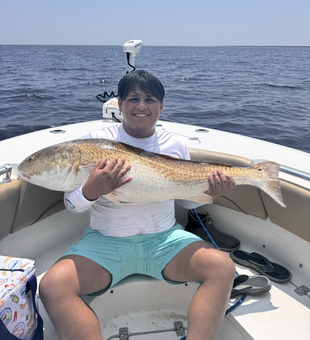 Huge 36-inch redfish caught while deep sea fishing in Manteo!