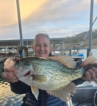 Laura with a caught a big crappie with on guided trip