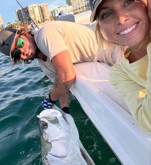 Smiling crew with silver tarpon release