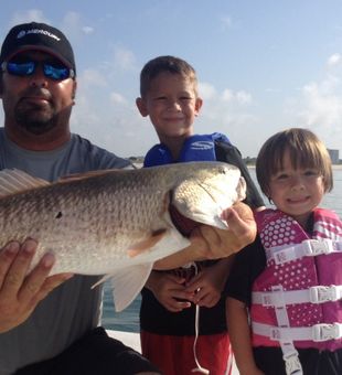 Kids  with their first fish in Orange Beach, AL