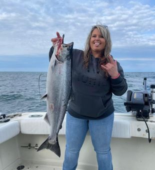 Big Chinook salmon catch on lake fishing charter boat