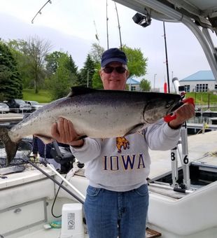 “Hooked a Chinook! Nothing beats salmon fishing on Lake Michigan.”