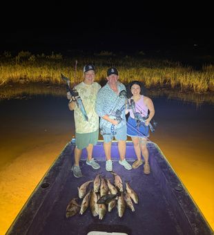 Grand Isle redfish lighting up the night!