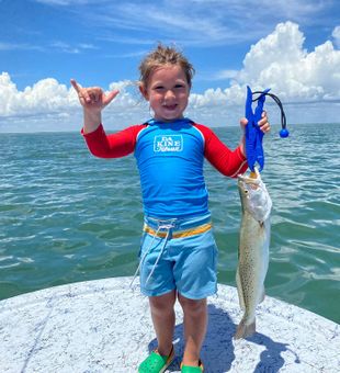 A young angler rocking his catch! - South Padre Island, TX.