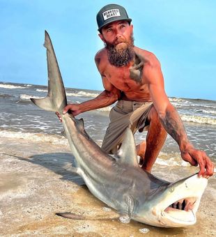 Sand between your toes, shark on your hook.