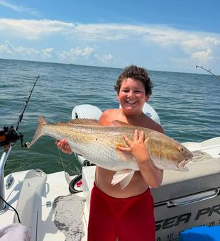 Massive Redfish caught by young angler - Lafitte, LA.