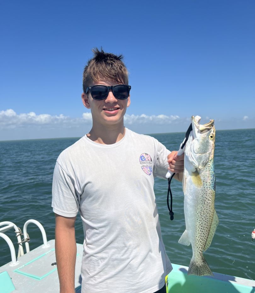 Professional fishing guide in South Padre Island, Texas helping anglers land quality catches.