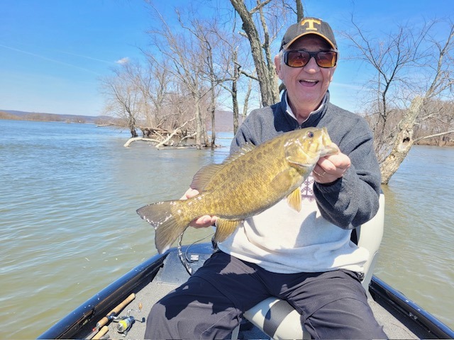 All Smiles Showing his Trophy Smallmouth bass!